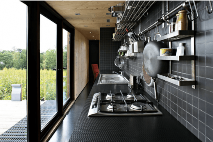 A galley kitchen opens onto a deck.