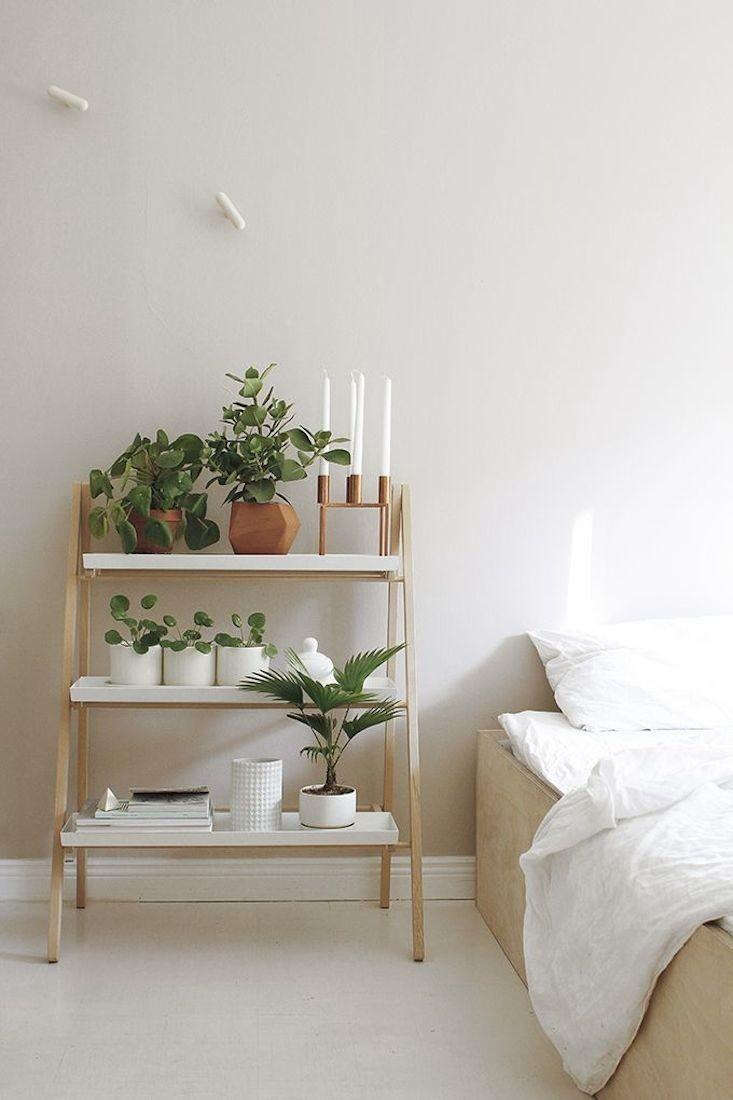 A foldable tabletop stepladder designed by Klaus Aalto has three shelves. And many different uses: bedside table, kitchen herb garden, and entryway console. Photograph via Kekkila.