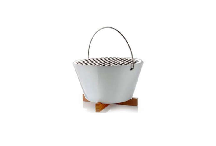 The compact Eva Solo Table Grill from Danish designers Claus Jensen and Henrik Holbaek is ideal for urban outdoor spaces. The wooden base protects your outdoor table from the heat; after grilling, the bowl, rack, and insert can be put in the dishwasher for easy cleanup; \$\269 at Amazon.