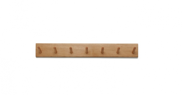  A solid oak Peg Rail made in Portugal has seven pegs and is £\150 from Another Country.