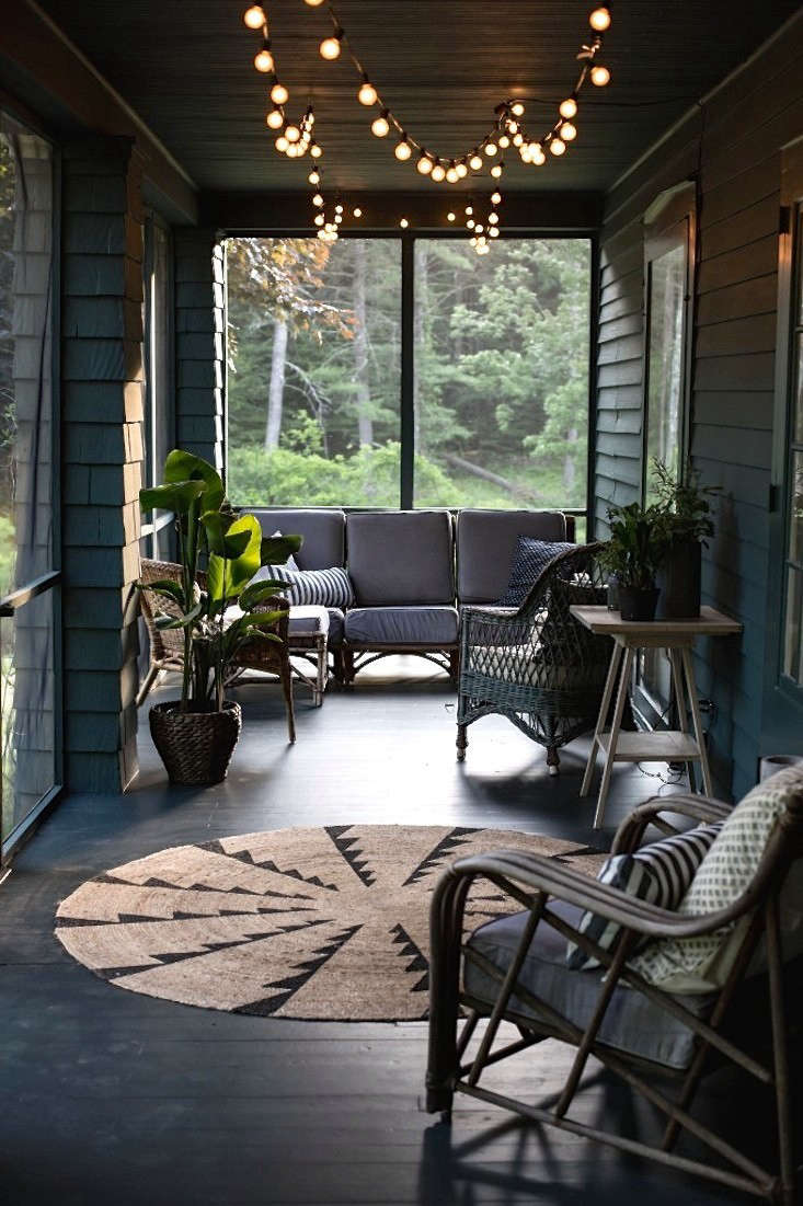 Design team Tara Mangini and Percy Bright of Jersey Ice Cream Co. rescued a nondescript and unloved screened porch in the Catskills–and made it magical. Photograph courtesy of Jersey Ice Cream Co., from Before & After: A Summer Porch Rehab in Upstate New York.