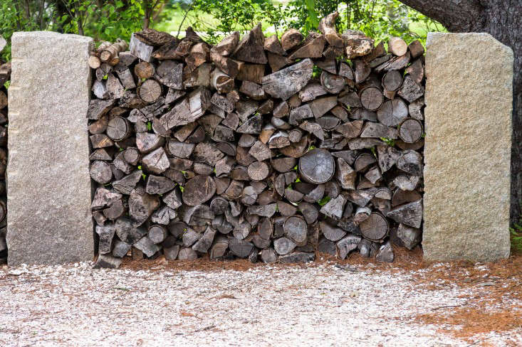 Woodpile as art. &#8\2\20;We sourced great old granite piers and used them to organize the woodpile,&#8\2\2\1; says Cunningham. &#8\2\20;I love firewood, I think it’s so pretty, and I love seeing utilitarian elements in a garden. Why hide them? Why not make them part of the atmosphere?&#8\2\2\1;