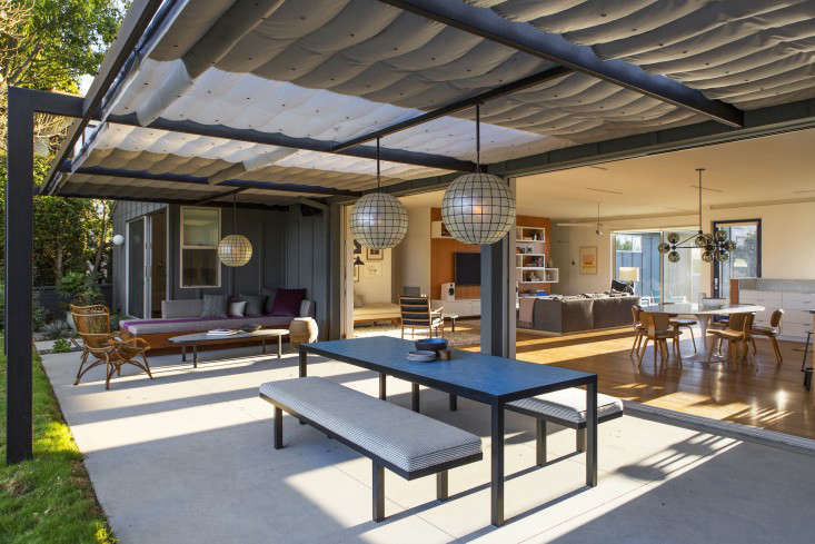 The pergola has a retractable awning. &#8\2\20;The awning is so big we were concerned that any one color in such a huge volume of material would feel like a lot, so we decided to make the awning three colors,&#8\2\2\1; says Kameon. &#8\2\20;It&#8\2\17;s done in a gradient of light, medium, and dark gray and doesn&#8\2\17;t feel bulky at all.&#8\2\2\1;