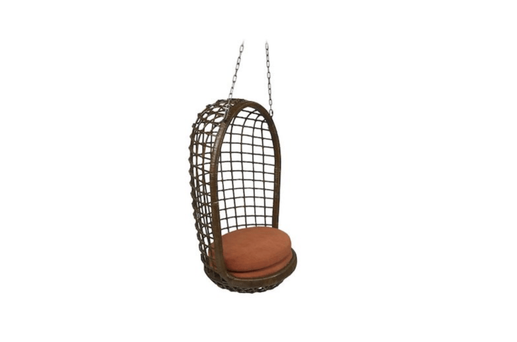 A Mid-Century Woven Rattan Hanging Egg Chair is \$\1,400 from \1st Dibs.