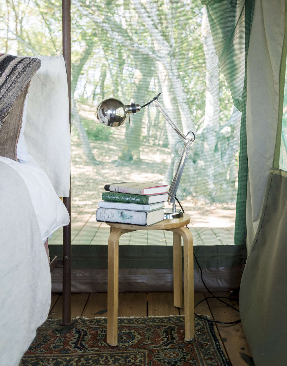 Aalto Stool with Books and Light as Bedside Table