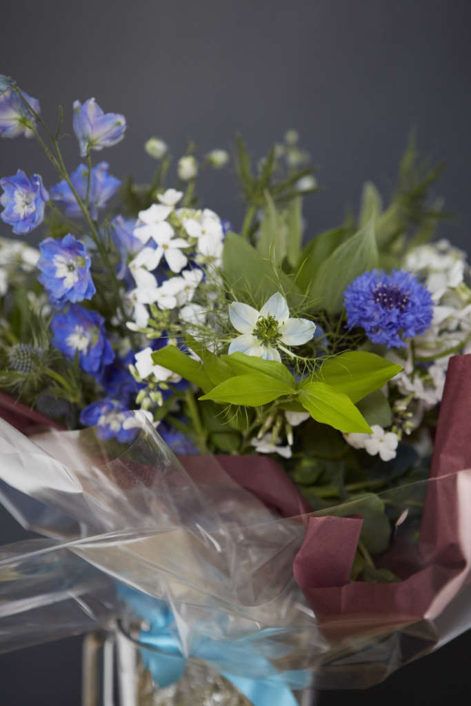 A bouquet in hues of blue and bright whites for the Mother of the Bride, thoughtfully handtied and finished in cellophane with enough water to ensure longevity for the duration of the wedding.