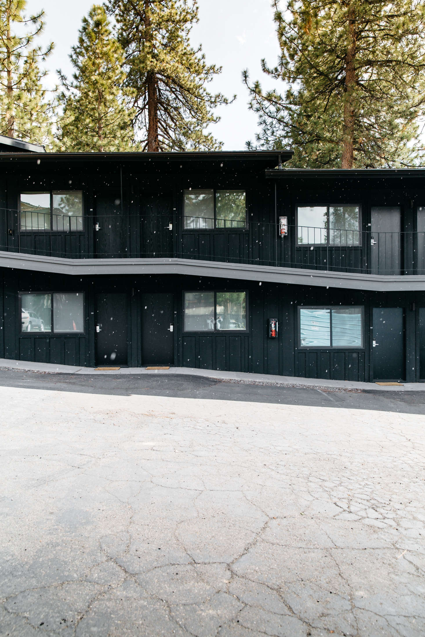 At the Coachman Hotel in South Lake Tahoe, California, the exterior of the buildings were painted a unifying coat of Benjamin Moore Black Panther. Photograph by Luke Beard and Matthew Bolt, courtesy of the Coachman Hotel.