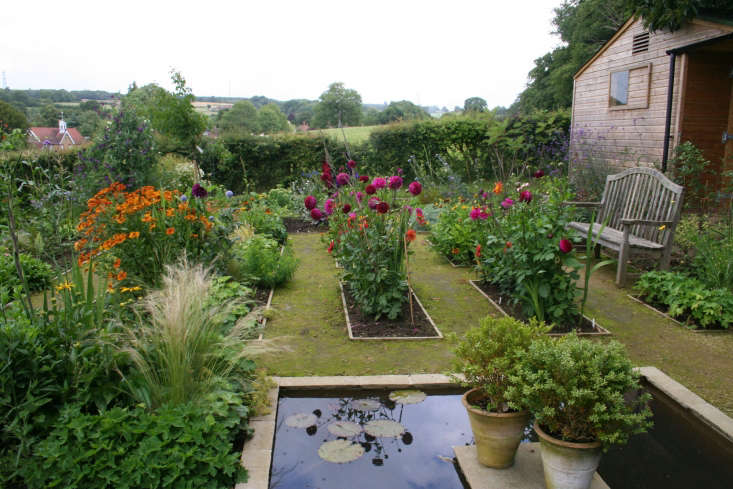 Annie Guilfoyle&#8\2\17;s kitchen garden includes beds of colorful dahlias.