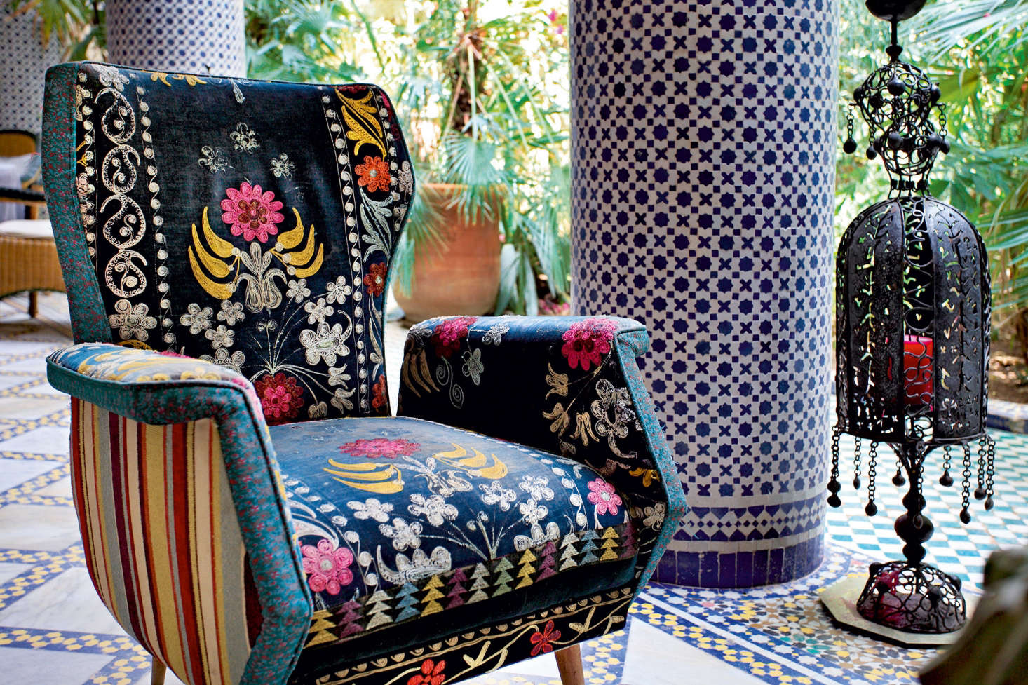 On the loggia at Riad Enija, a chair from the flea market has been reupholstered in vintage fabric.