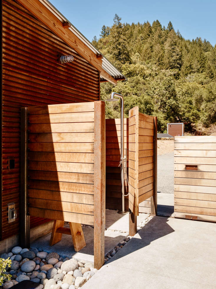 An ipe wood pool shower is tucked around the corner, and a rolling gate provides a means of egress from the pool pavilion.