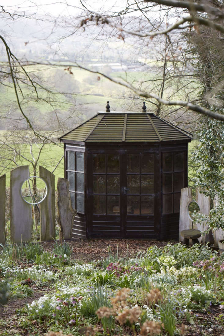 Many of the flowers are framed by the unusual fence made from driftwood and bicycle tire rims, with which Celia fell in love at the Malvern Flower Show.