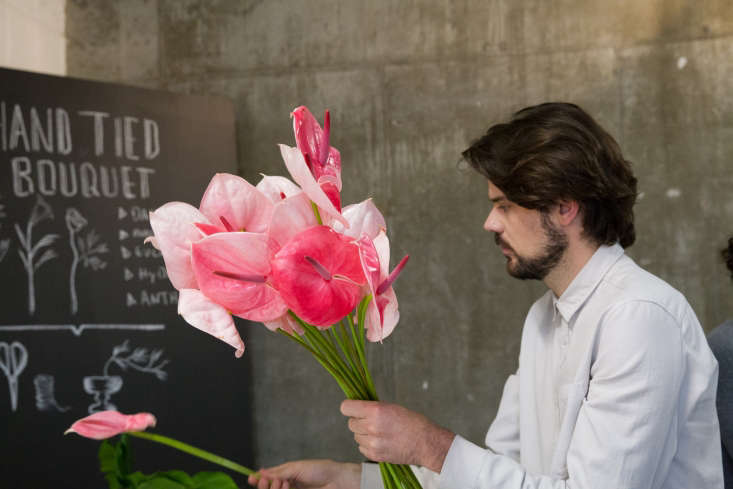 Wagner Kreusch arranges anthuriums.