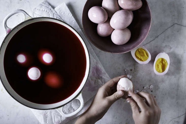 Margot is admiring the natural beauty of Kitchen Repertoire&#8\2\17;s Easter eggs dyed with vegetables and spices. Photograph by Dana Gallagher, courtesy of Kitchen Repertoire.