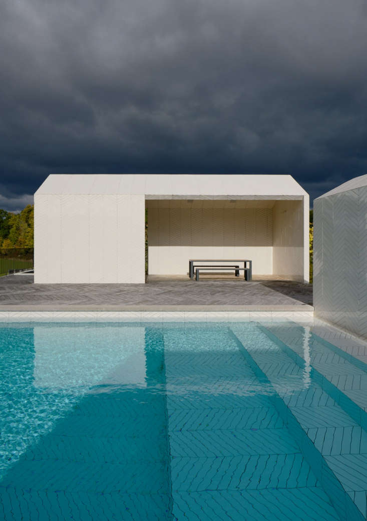 The designers embraced the pool water as part of the materials palette, intending for the white tile to take on increasingly dark turquoise hues as the pool stairs get deeper.