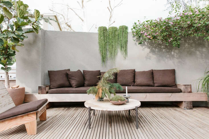 Tall courtyard walls topped with planter troughs are a signature of the designers&#8\2\17; work (Ramin&#8\2\17;s LA garden also has courtyard walls, crowned with planters watered by drip irrigation). Oversized built-in seating adds a lived-in, layered texture to the intimate outdoor room.