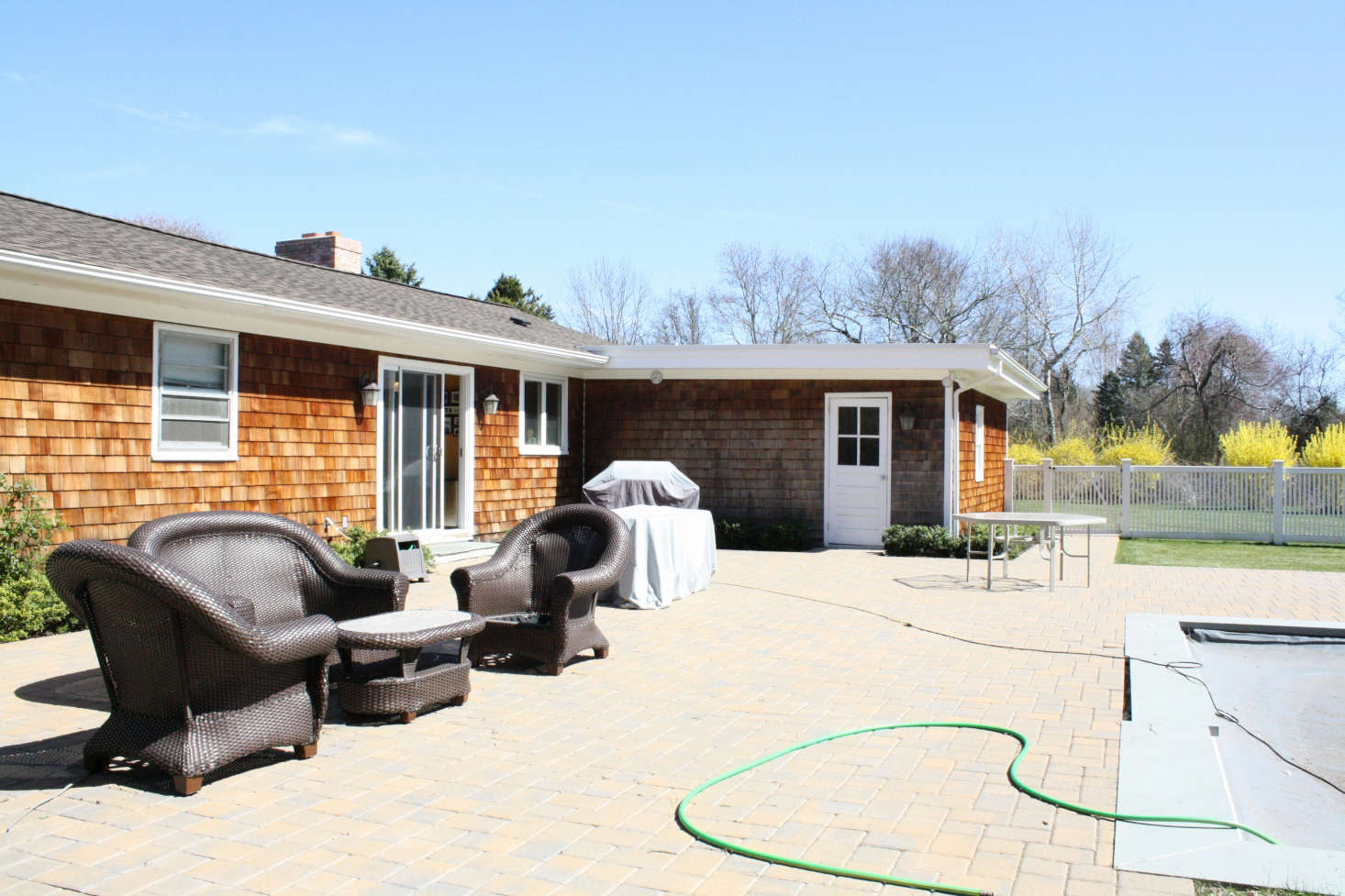 The poolside patio, before. Photograph by Maria Milans del Bosch.