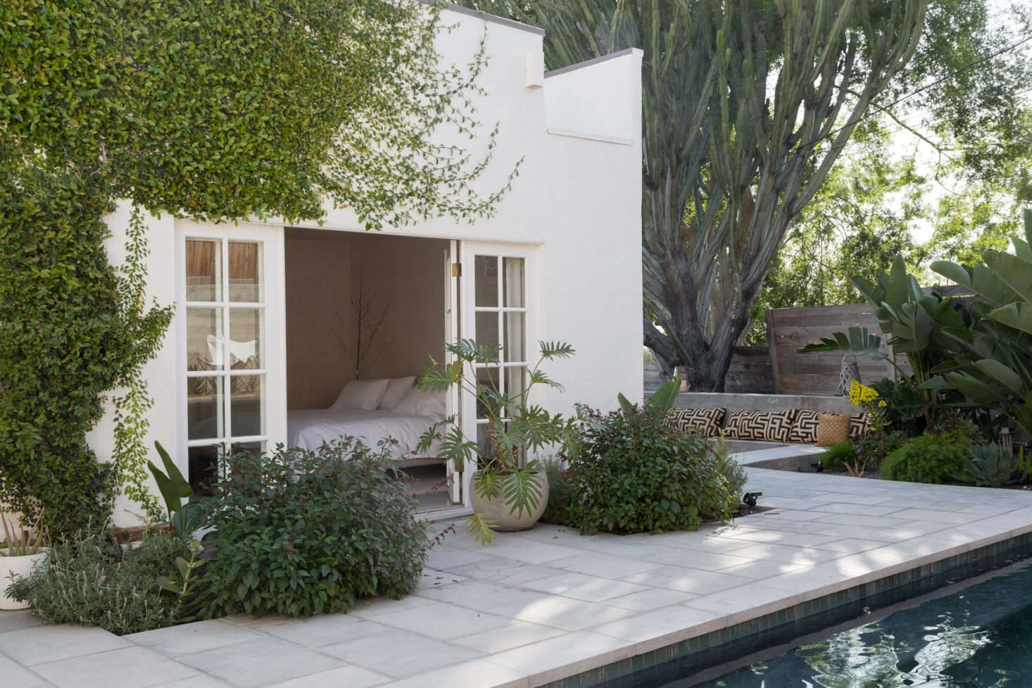 Another entry to the backyard: French doors lead from a first-floor bedroom to the pool.