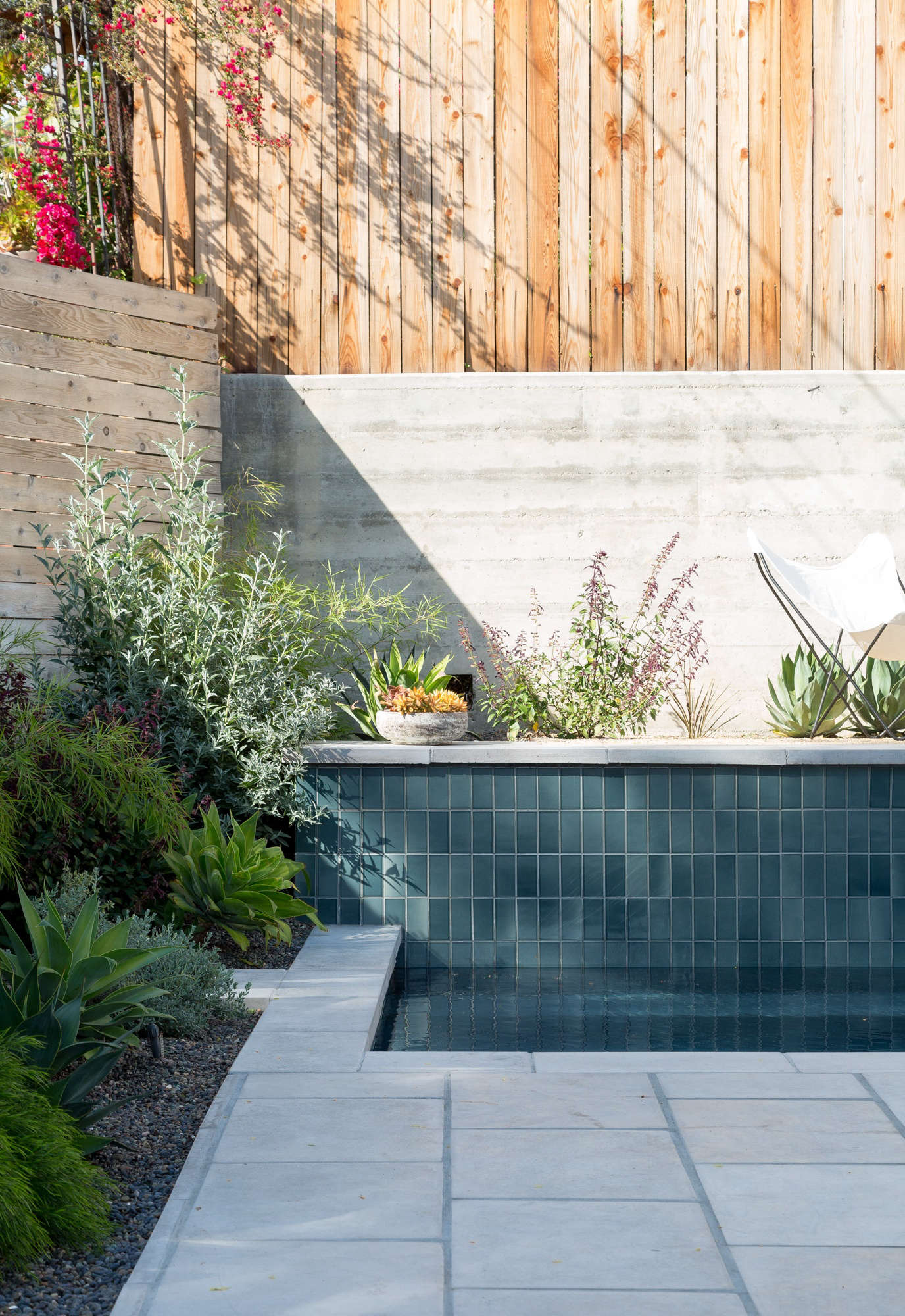One raised side of the pool is tiled in Heath