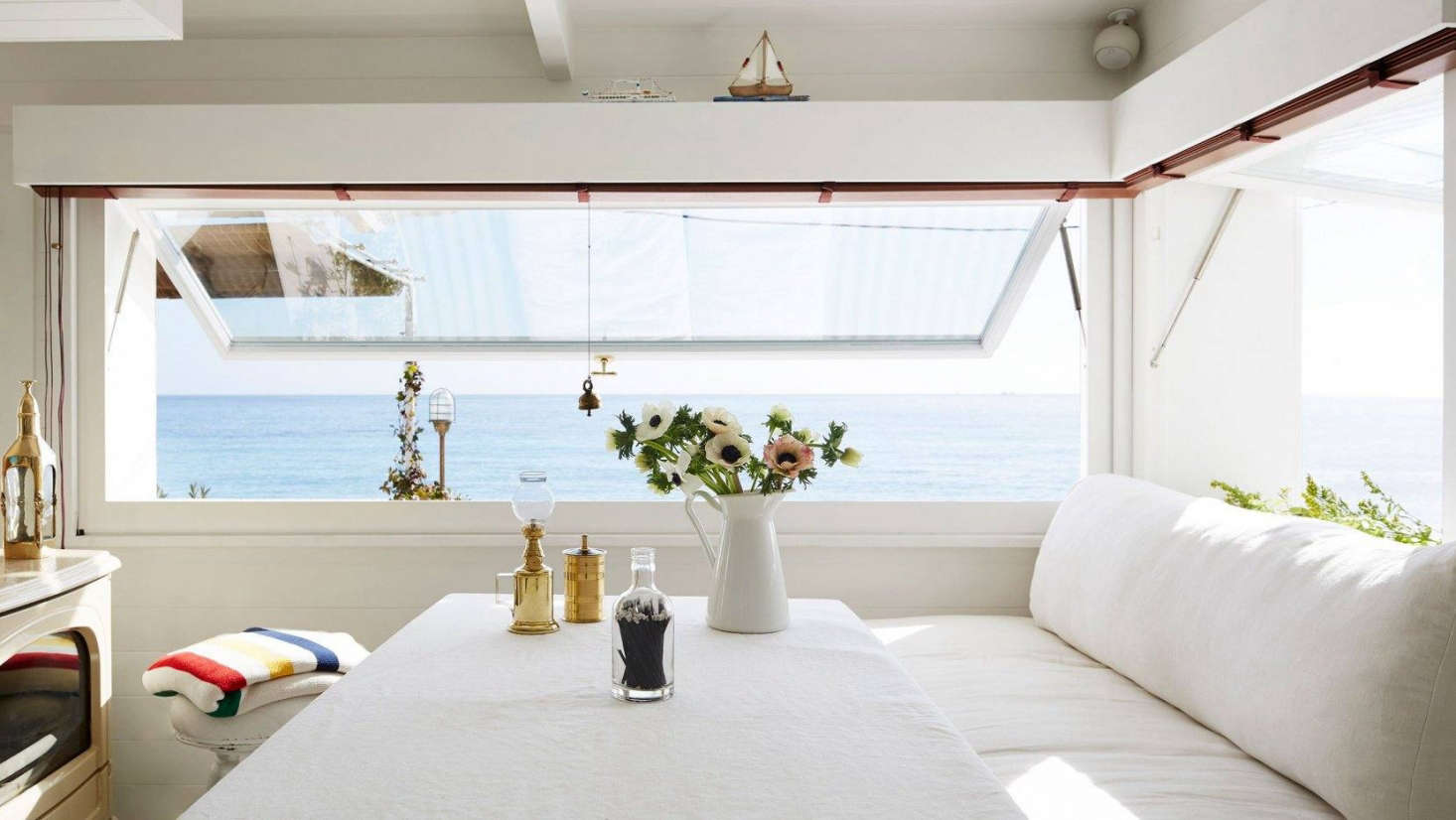 A Riviera seaside cabin that feels like a houseboat. See how to replicate the kitchen design in Steal This Look: A Tiny, Seaworthy Kitchen on the French Riviera.