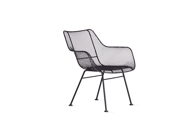 A reissue of the original Russell Woodard design, a molded Sculptura Occasional Chair made of powder-coated iron is 33.5 inches high, 30 inches wide, and .5 inches deep; $795 at Design Within Reach.