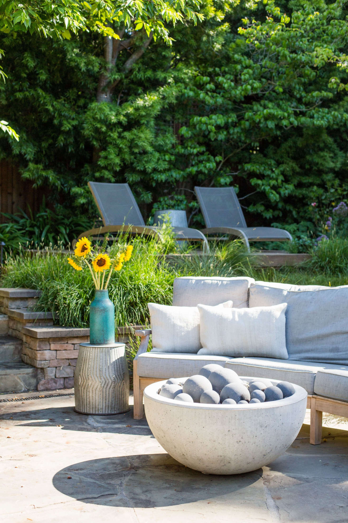 A ridged metal side table is actually a planter, turned upside down. Available in two heights, a Metal Peyton Barrel is from $49.99 to $89.99 depending on size at Cost Plus World Market.