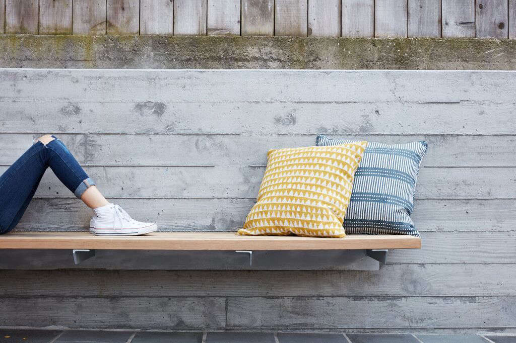 Custom floating cedar benches add built-in lounging space and 