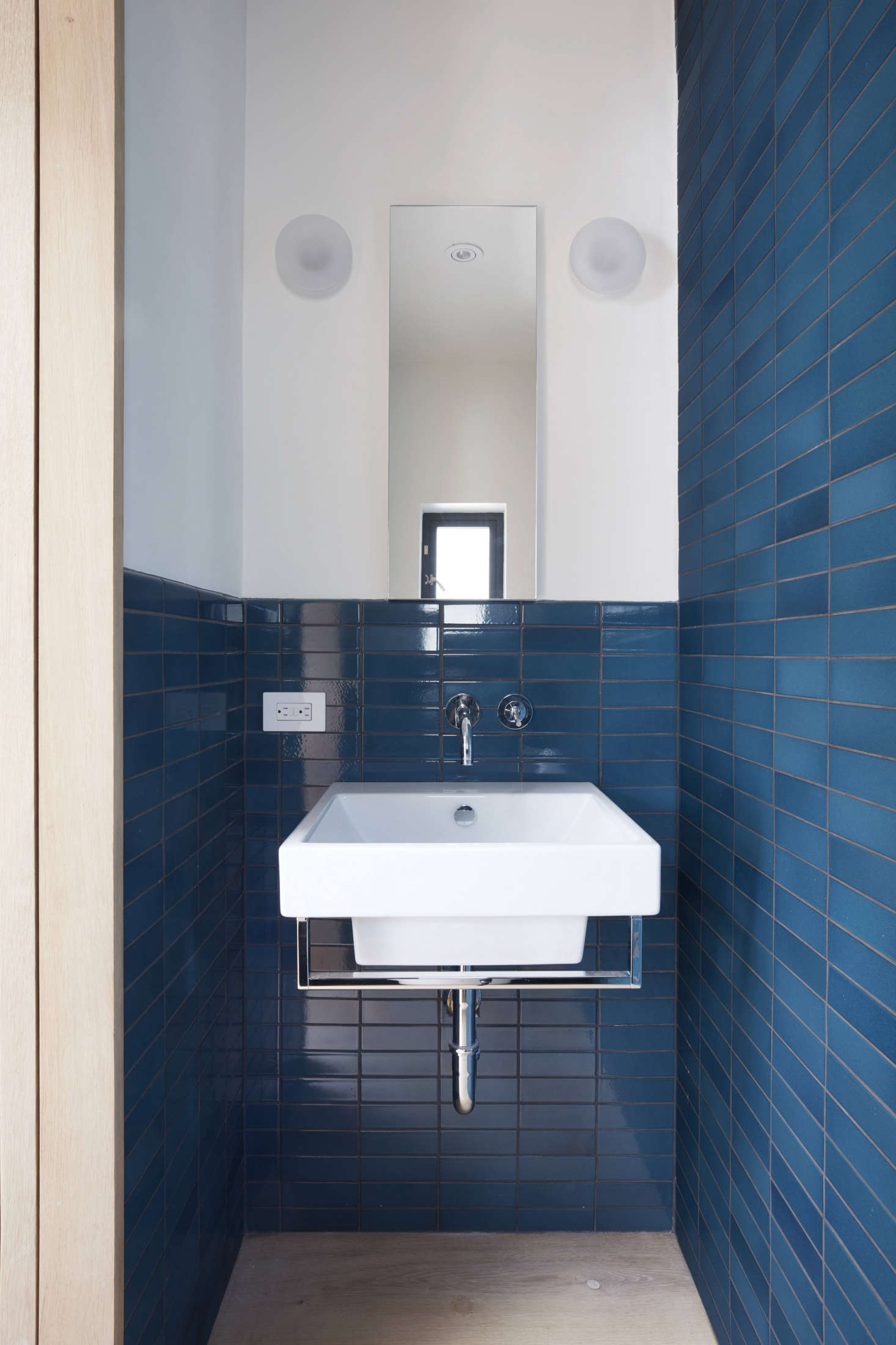 The WC is just big enough for a small sink and toilet. The blue tiles are Heath