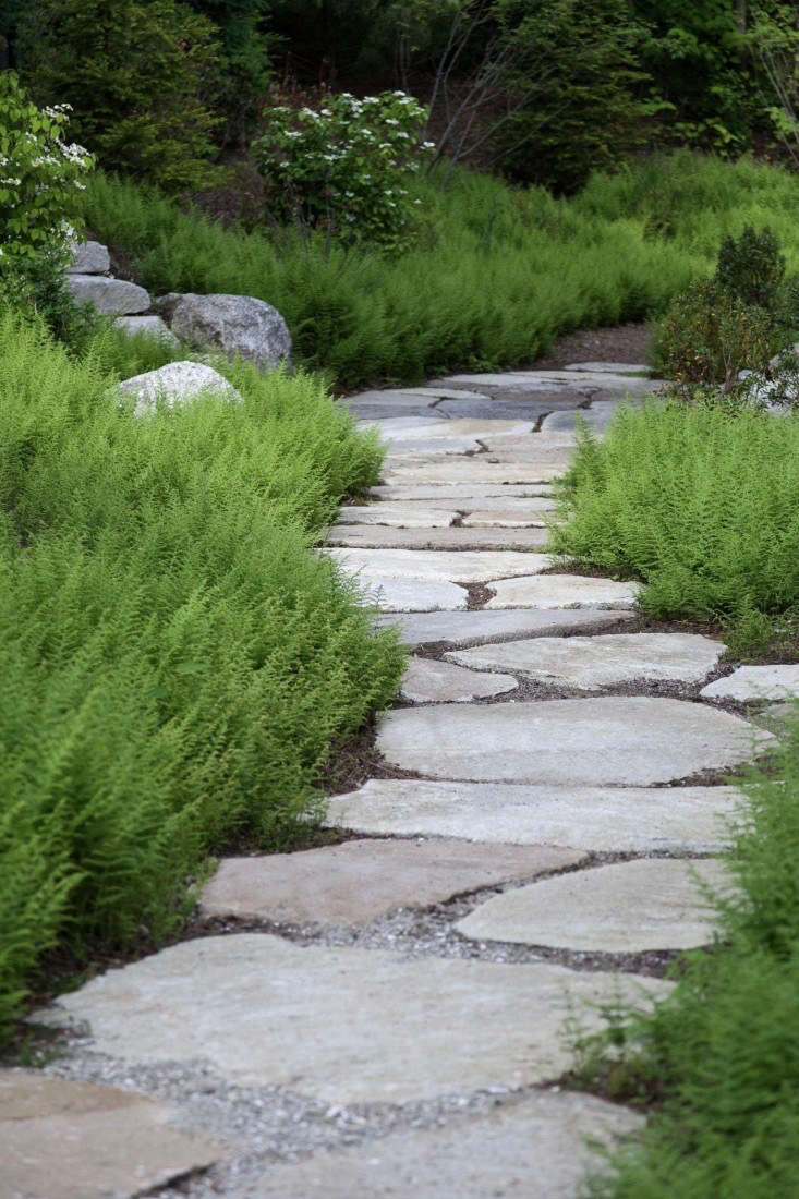 Maine coastal gardens are neither dainty nor precious. The hardscaping material of choice? Granite or fieldstone pavers that look as though they