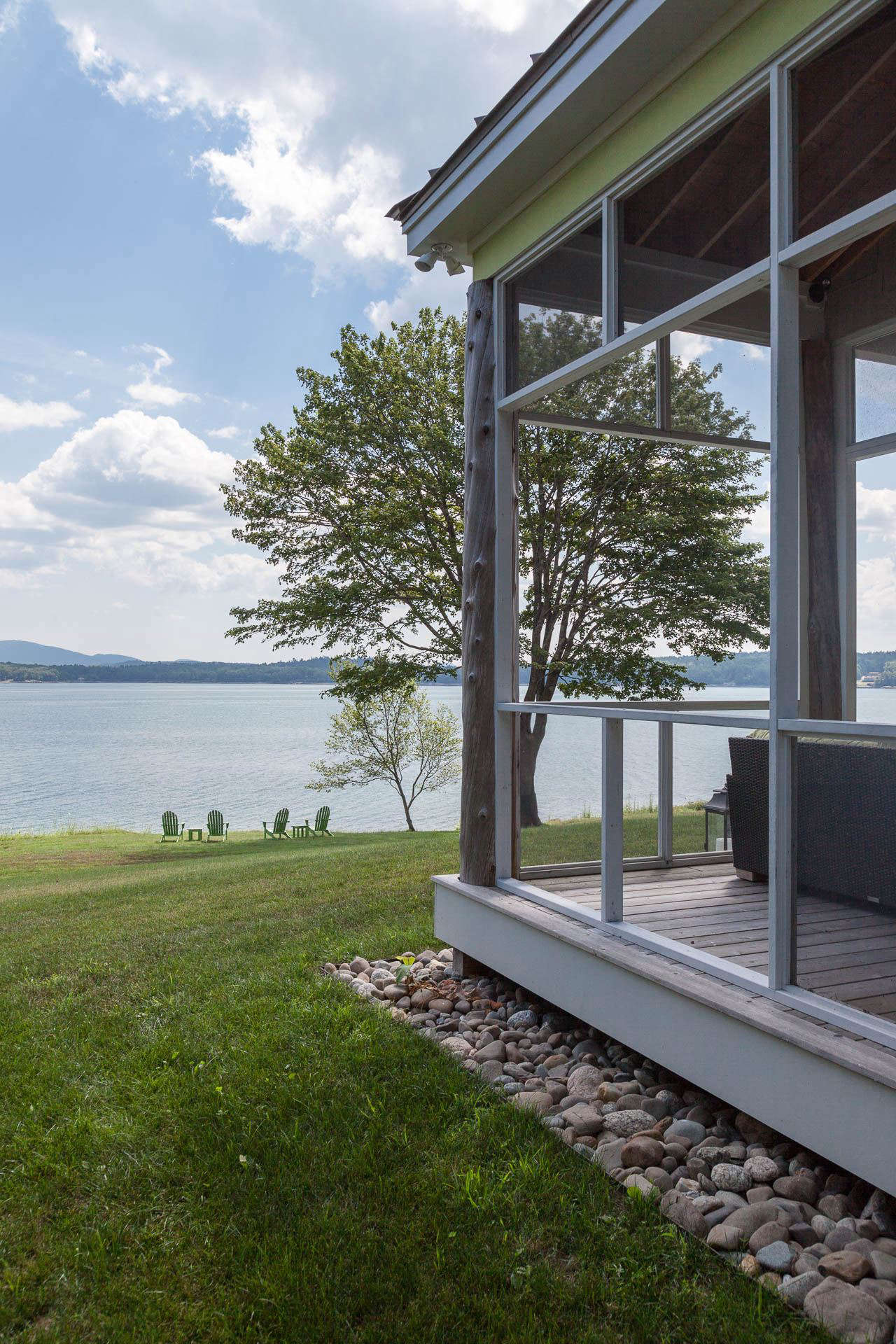 A screened porch is oriented toward the water views and has a perimeter French drain, in a garden designed by Massachusetts-based landscape architect Matthew Cunningham. Photograph by Matthew Cunningham, from Landscape Architect Visit: Clamshell Alley on the Coast of Maine.