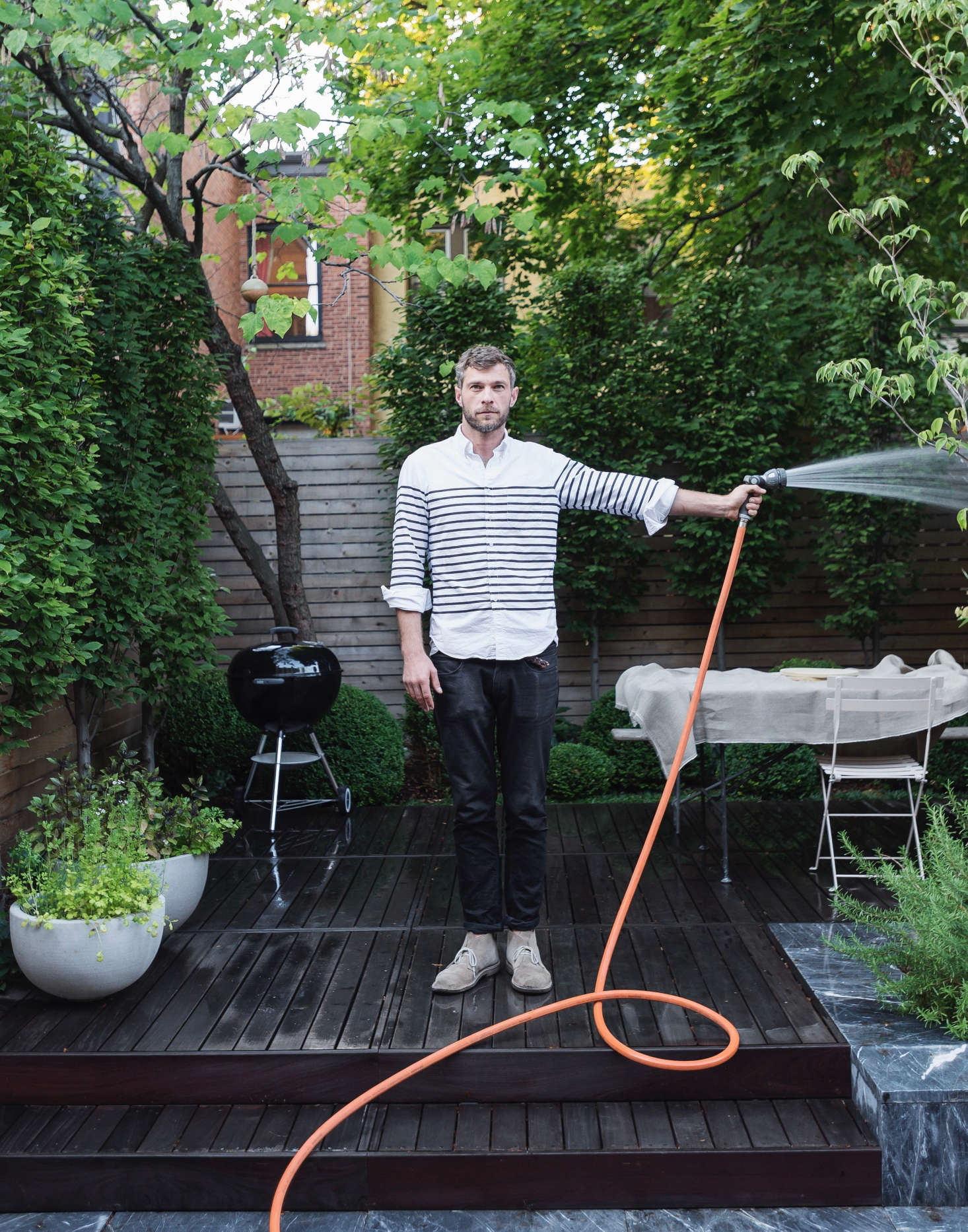 Designer Brook Klausing in a Brooklyn backyard. See more of this garden in our Gardenista book. Photograph by Matthew Williams for Gardenista.