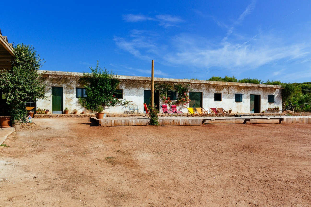 The main structure, formerly home to the shop, offices, and a potting room, is now 