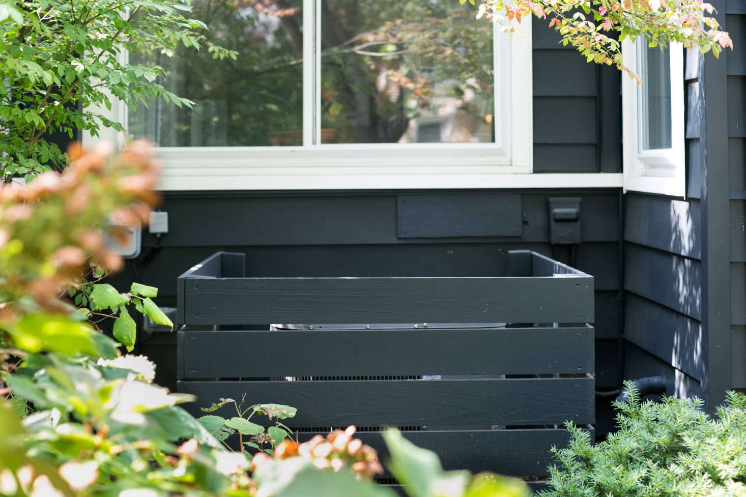 Simple wood slats hide the air conditioner.