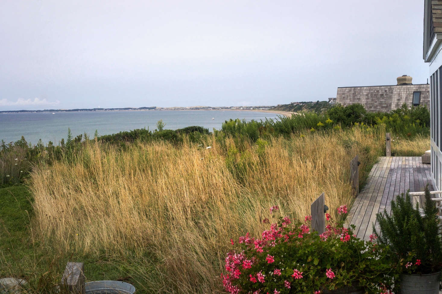 Along the bayside of the house, a simple path mowed through the meadow allows for a breathtaking cliff walk.