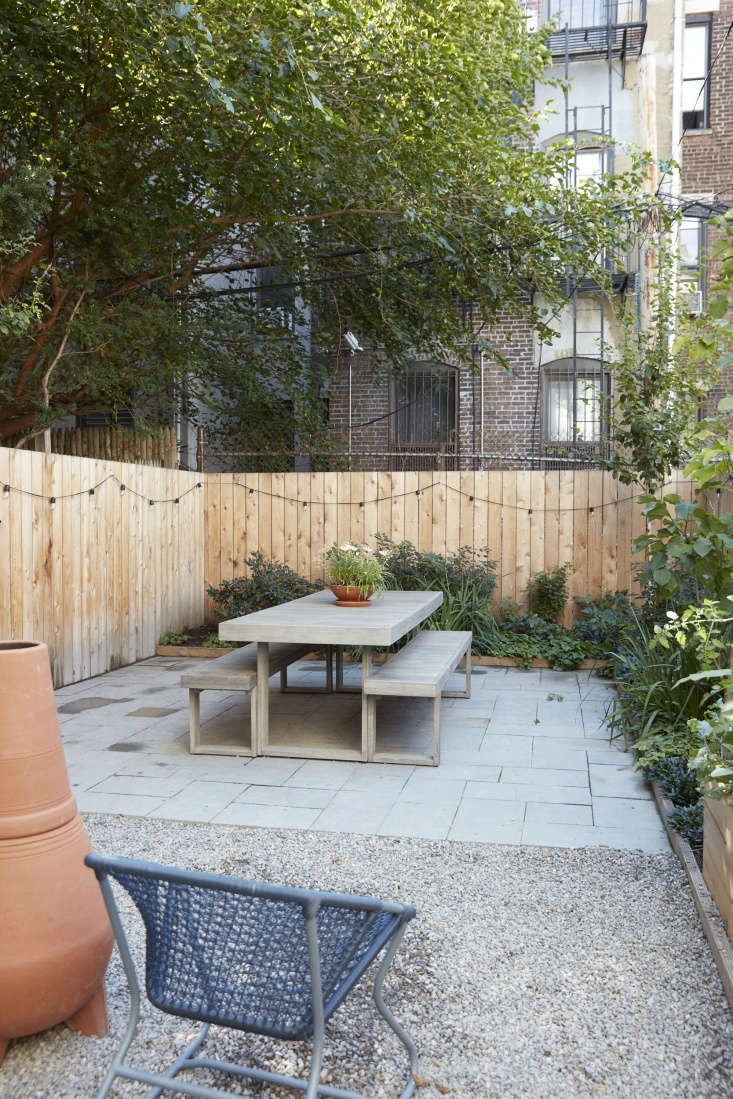 The outdoor table and bench is the Weathered Grey Portside Expandable Dining Table Set from West Elm.