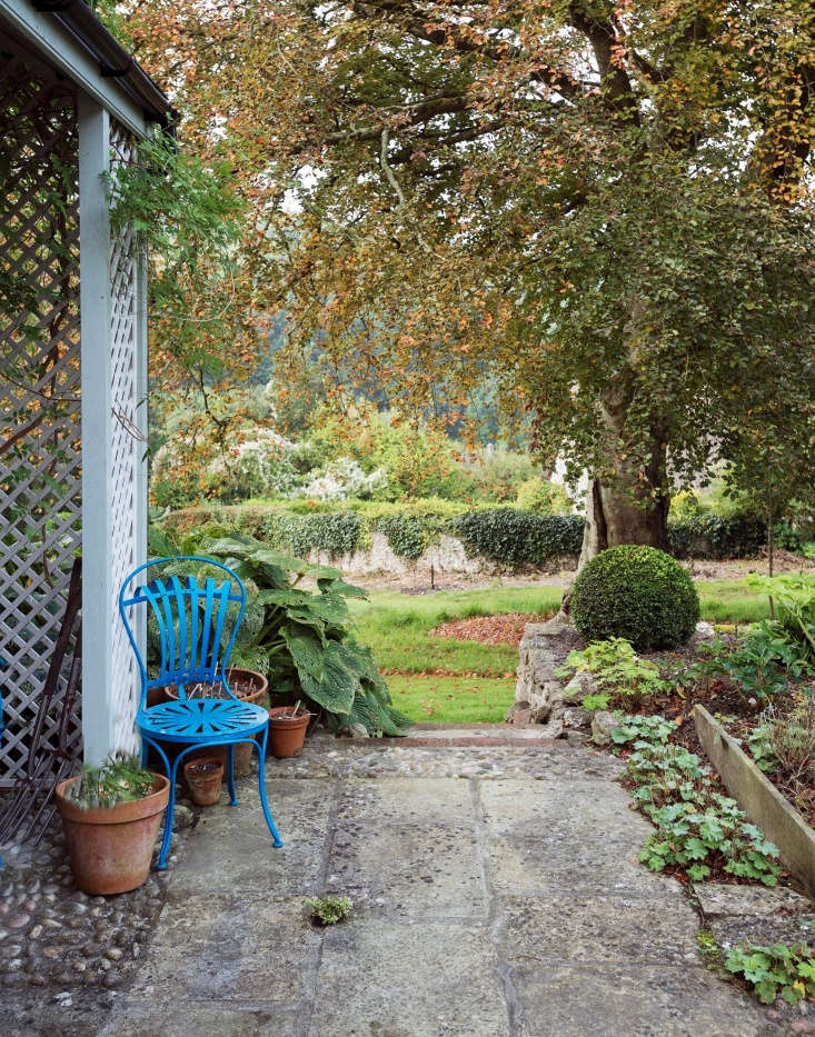 Pentreath and McCormick have a stone patio at the edge of a lawn.