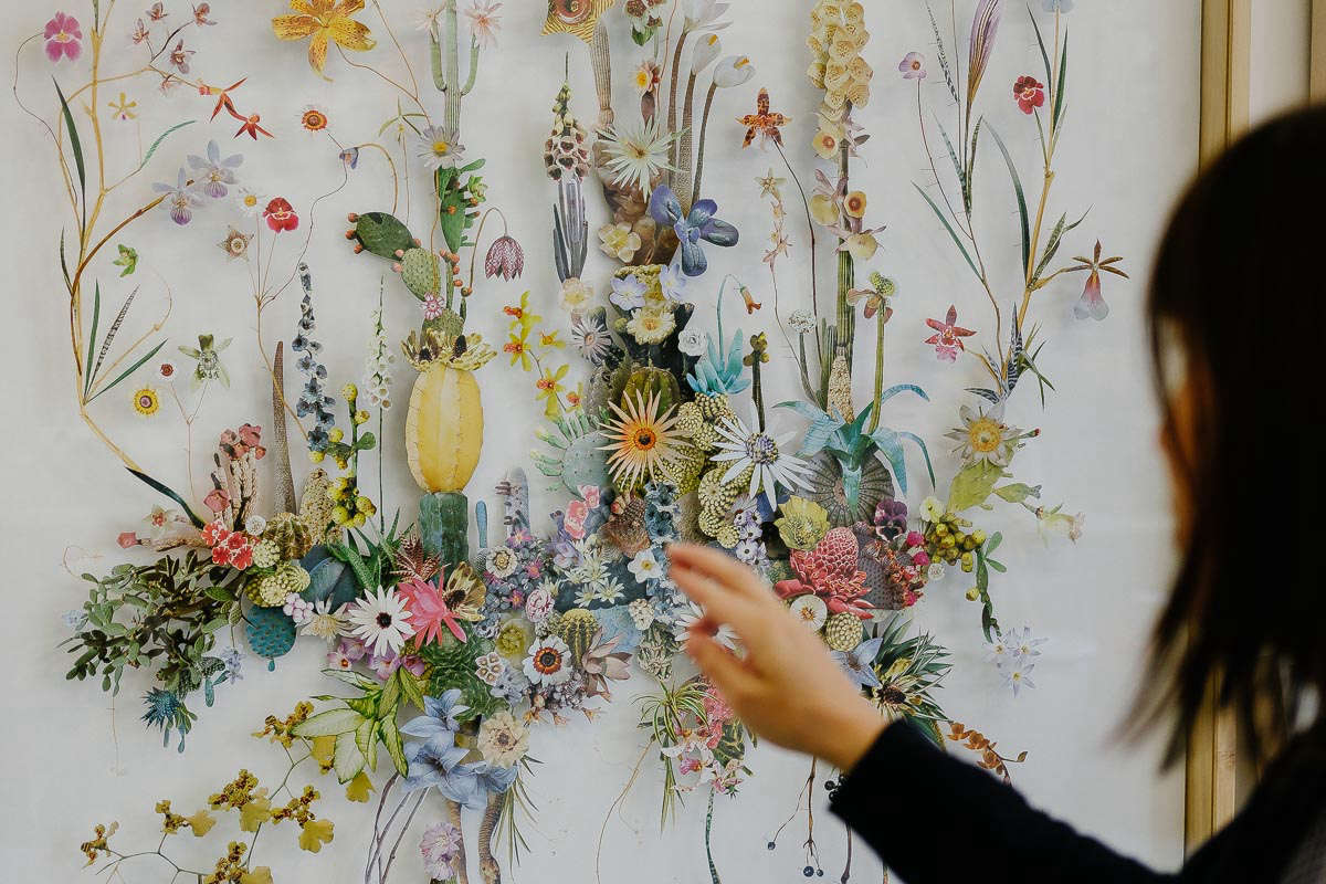 A finished work. Note the pins elevating each image, root and stem.