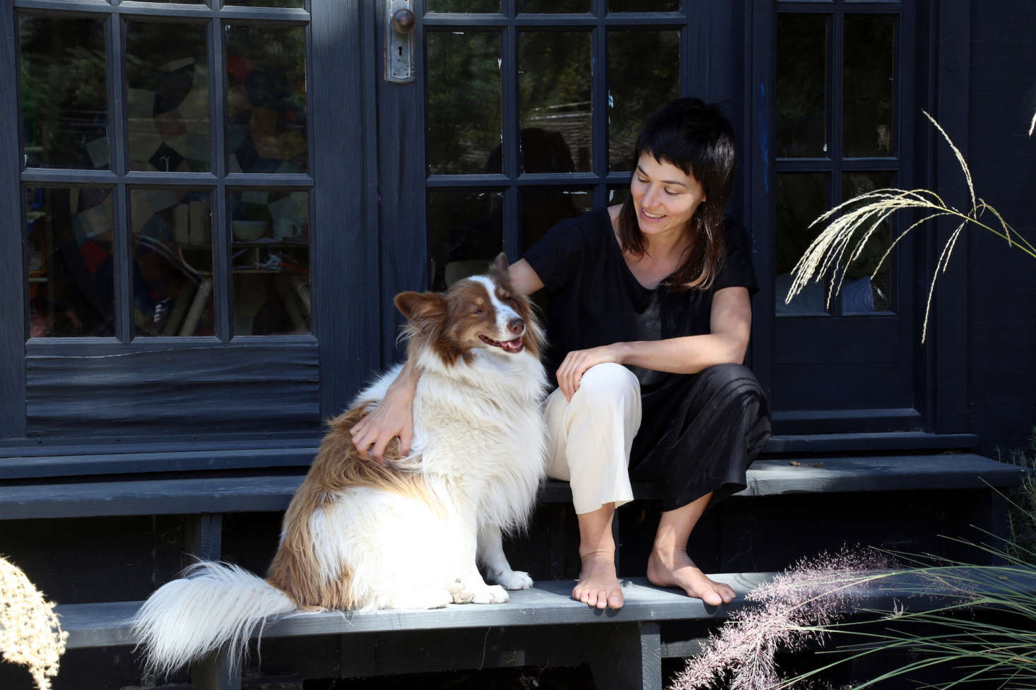 Artist Carly Jo Morgan and her dog.