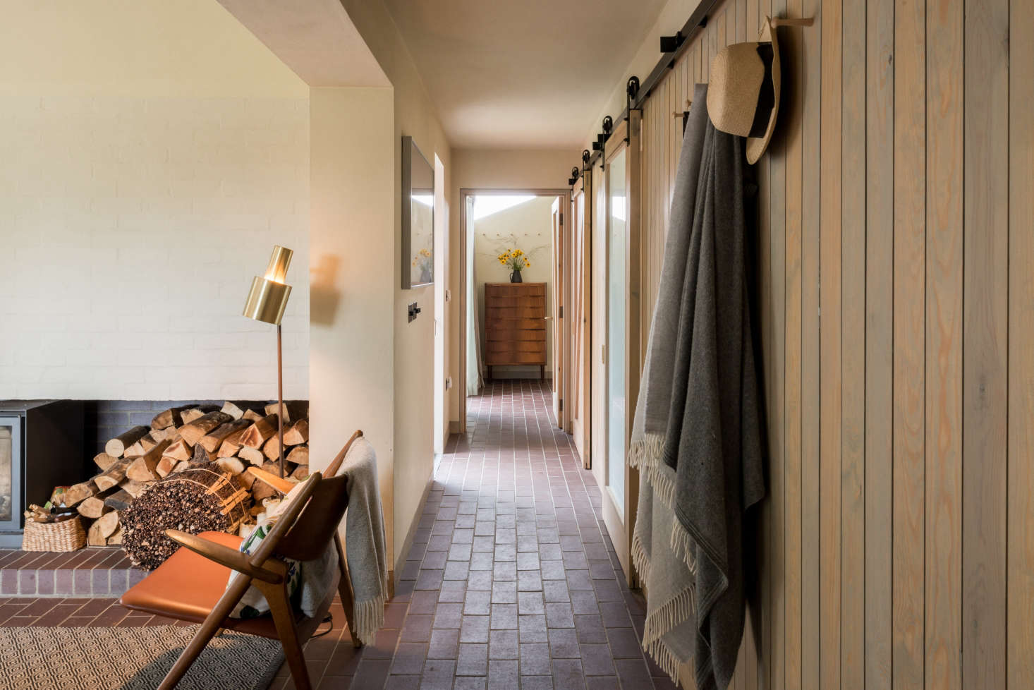 The brick fire surround in the living area contains a deep recess for logs and kindling.