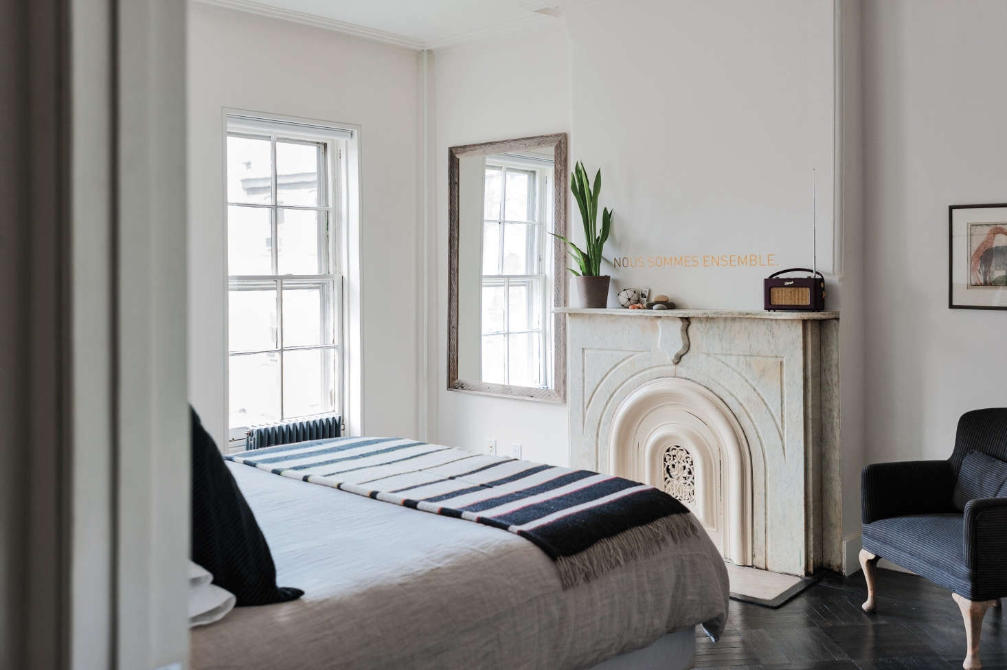 A non-functioning fireplace in a small bedroom by designer Elizabeth Roberts. Photograph by Matthew Williams from Remodelista: A Manual for the Considered Home.