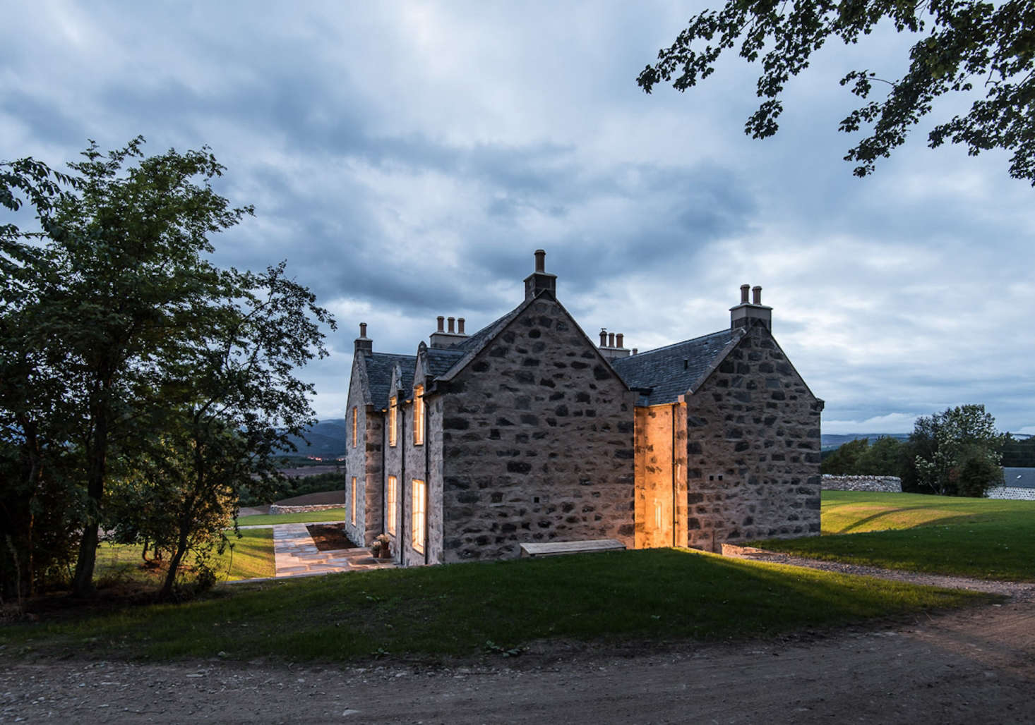 The refurbished farmhouse at night.