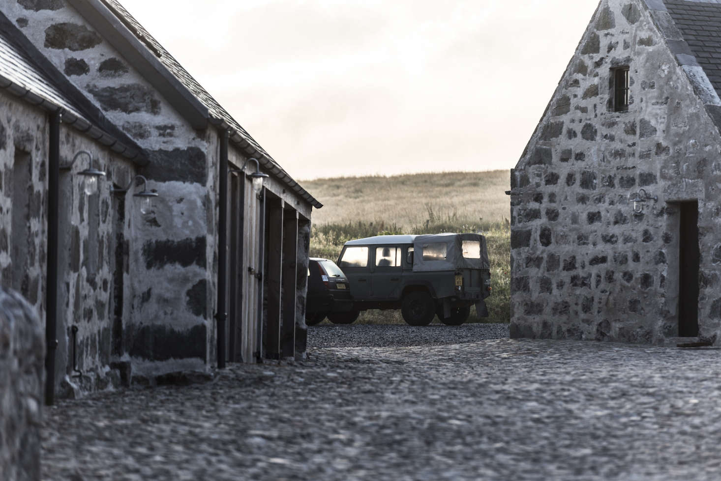 The car stables, located next to the horse stables (now converted into lodgings), house an early-edition Land Rover for guests