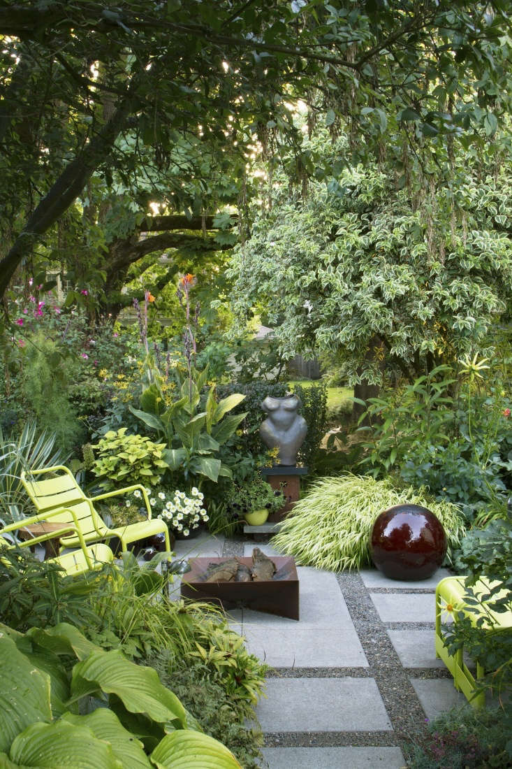 Layering plants creates a sense of depth and distance in a small garden.