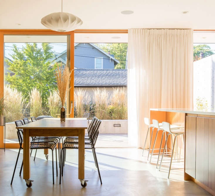 A view through the eat-in kitchen to the back patio. The detached garage is visible at the back.