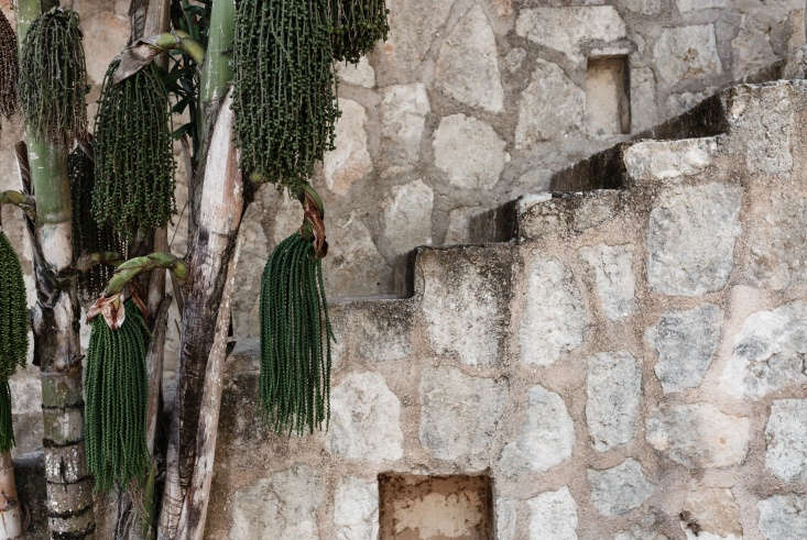 A limestone stairway leads through the walled grounds.