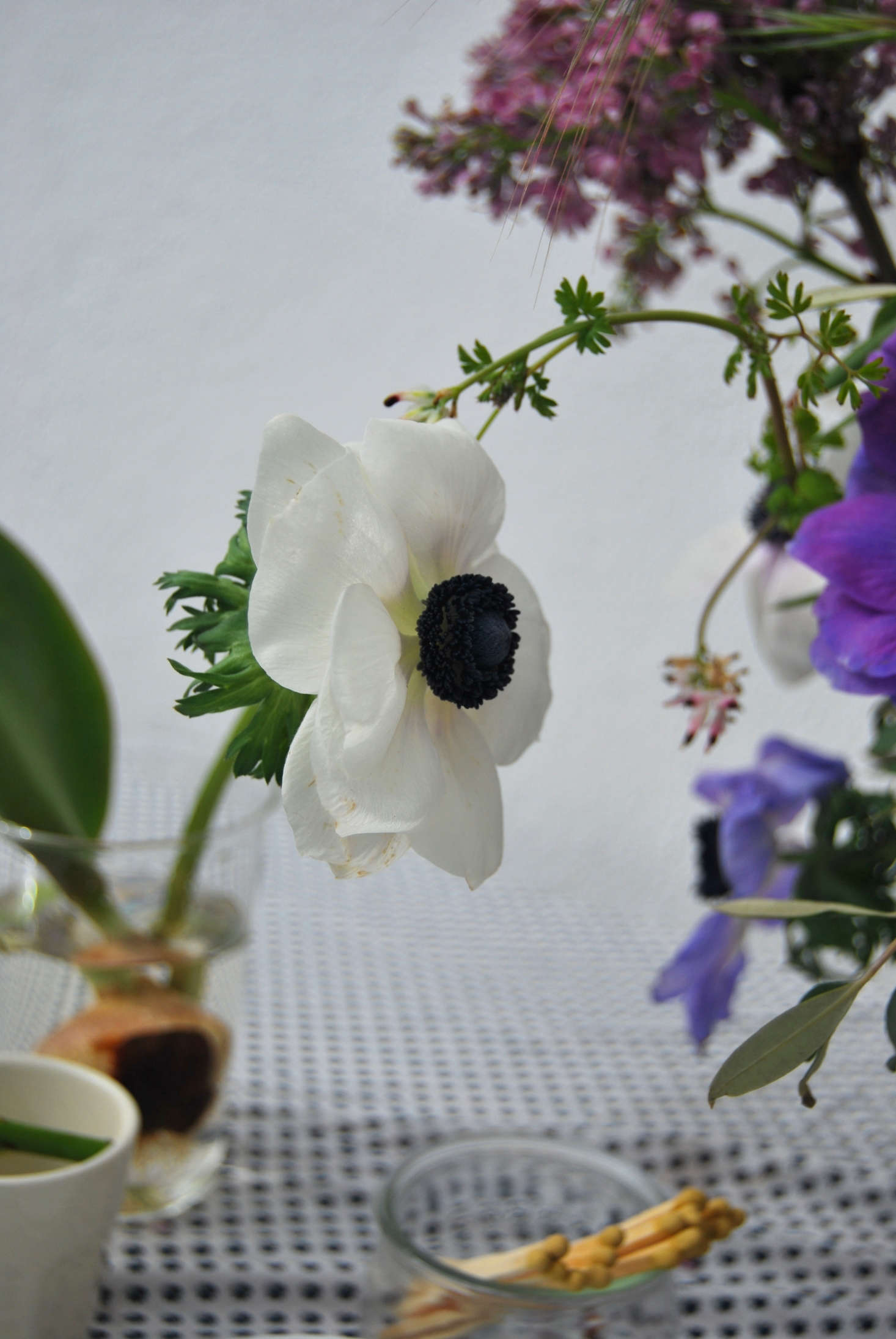 Anemones show their length and work as a focal flower in my Mediterranean-style spring arrangement.