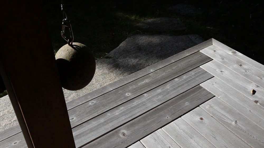 A view of the notched cedar decking and the hitching post ball.