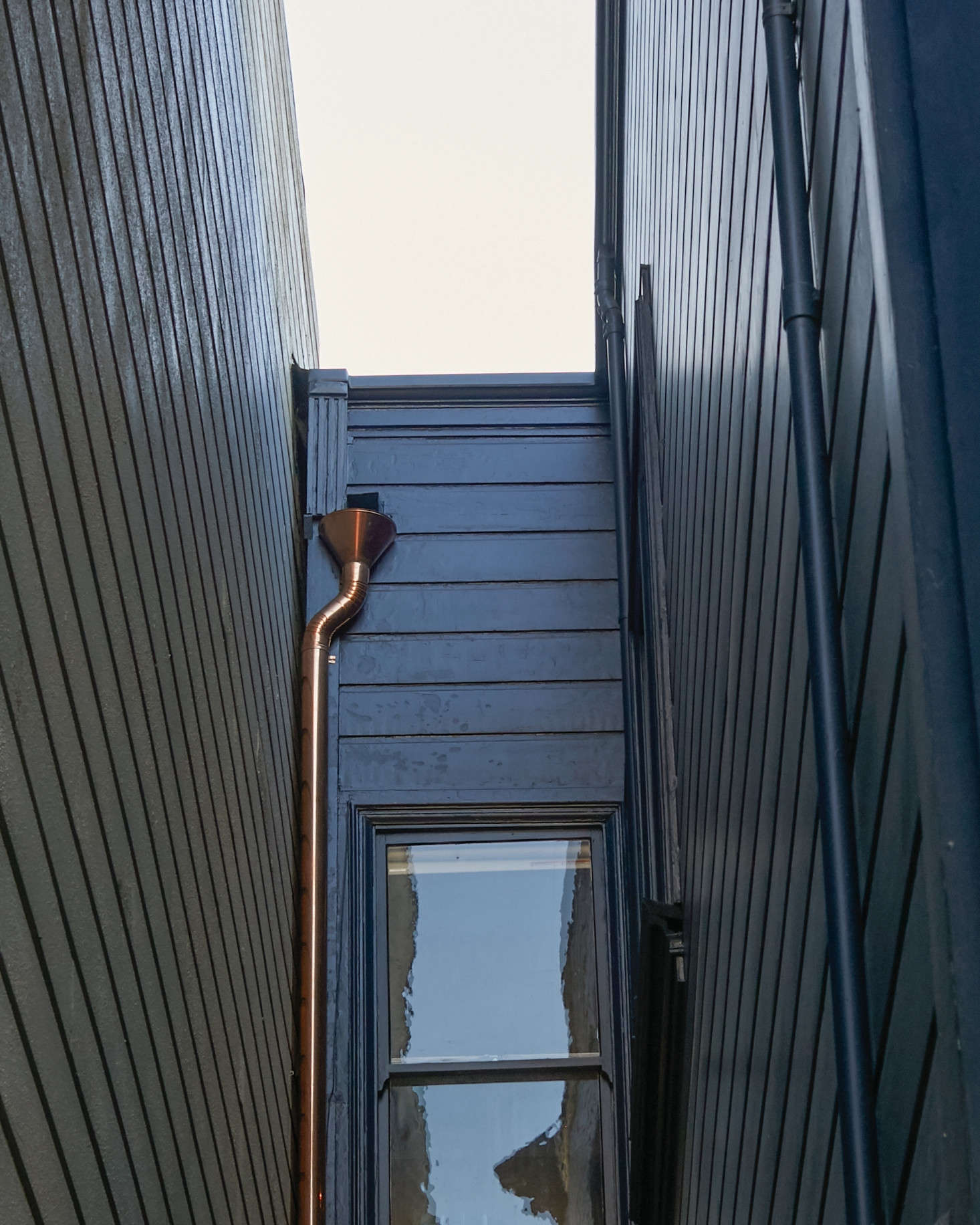 Zooming in on the San Francisco Victorian pictured above, we can admire a copper downspout, which will develop an aged patina over time. Photograph by Daniel Dent.
