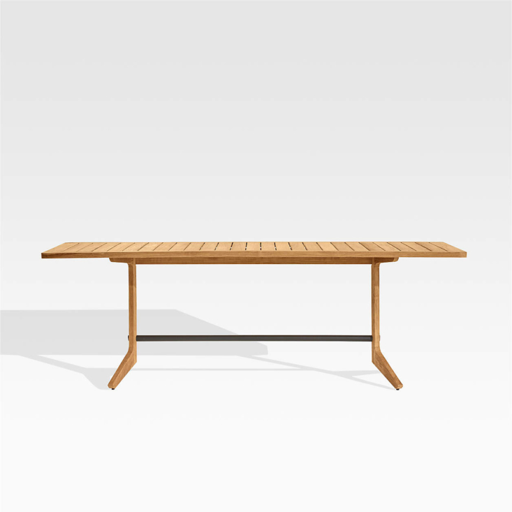 The Kinney Teak Outdoor Dining Table, with a steel strut and trestle legs, is made of solid wood that&#8\2\17;s certified by the Forestry Stewardship Council; \$\1,699 at Crate & Barrel.