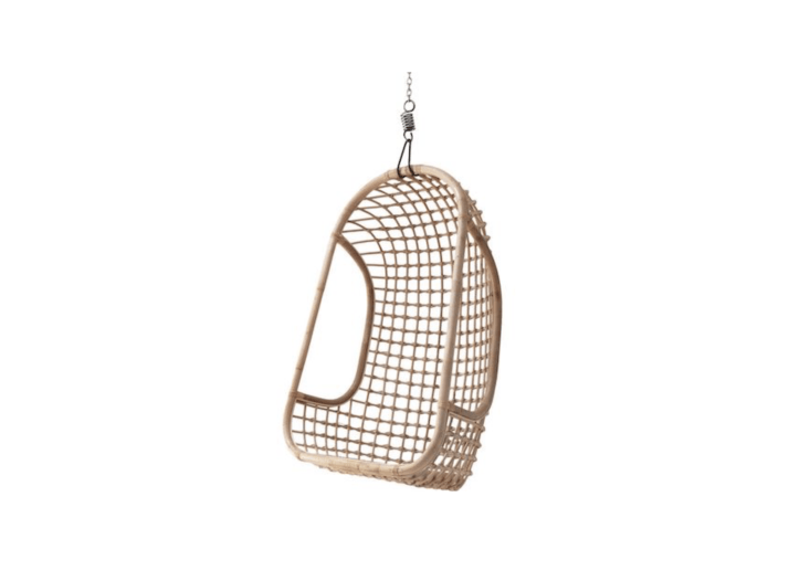 A Rattan Hanging Chair bt HK Living is available in white, black, or natural as shown. It is €\209 from WOO Design.