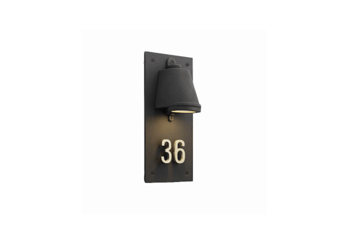 An entryway sconce with polished brass house numbers from Belgium-based designer Tekna is part of the Nautic collection, Housenumber is designed to evoke “old trains and ships from a bygone age,” says designer Eric Huysmans. For more information and pricing, see Tekna.